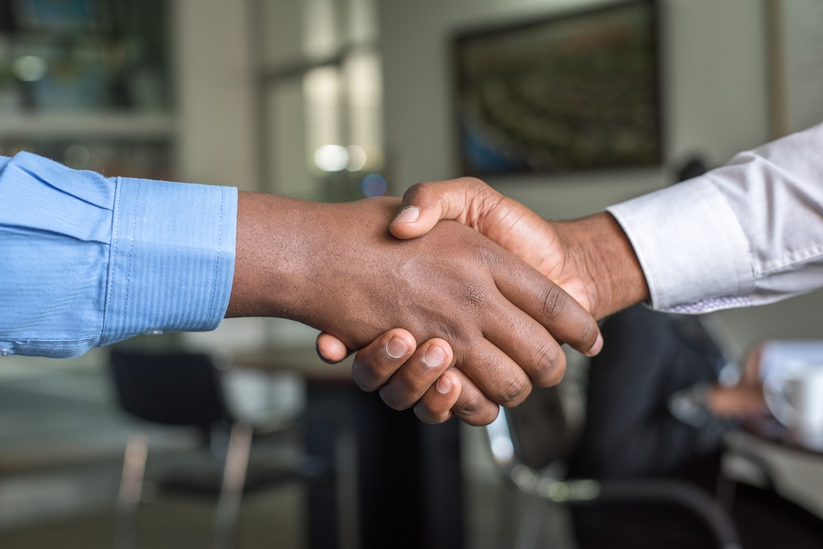 Business partners shaking hands after a meeting